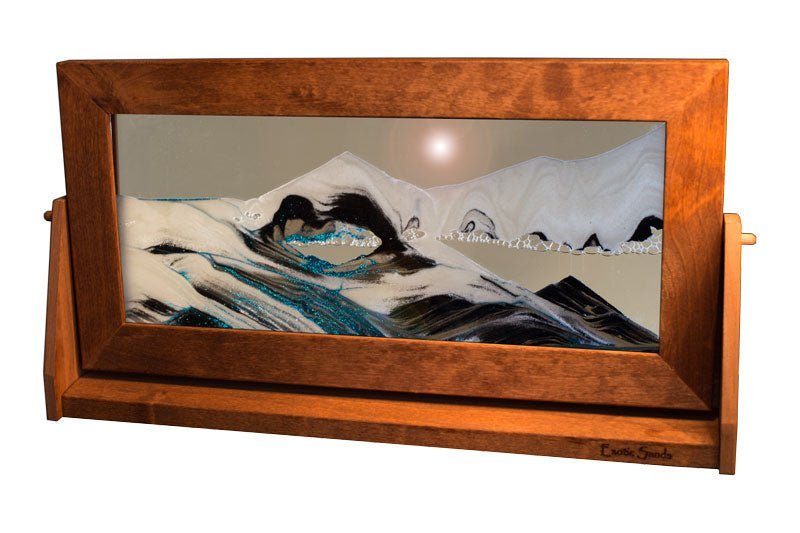 XL Moving Sand Art Picture by Exotic Sands, made in America. Features an alder wood frame on a swivel stand, with glass encasing pristine black and white sands suspended in arctic clear liquid.