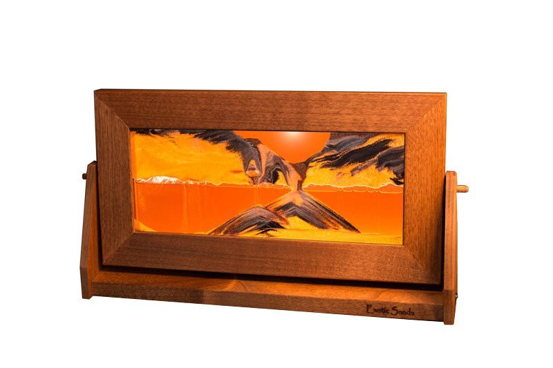 Desert Sand Picture in a alder wood frame and swivel stand featuring sunset orange liquid, copper glitter, and falling coral pink sand. Made in USA by Exotic Sands
