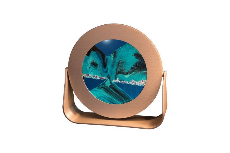 Deep Sea moving sand picture with a 7" round silver metal frame. Contemporary gift featuring Exotic Sands sculptures and hourglass design.