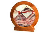 Sand art picture by Exotic Sands USA Round cherry wood frame with white sands and red glitter and clear liquid