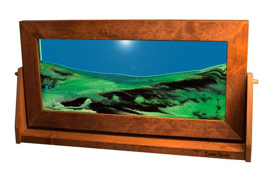 Extra-large Moving sand art picture featuring flowing black and green sands suspended in vibrant turquoise liquid. Encased in an alder wood frame with a swivel stand, this mesmerizing, ever-changing sand art adds a dynamic touch to any home or office